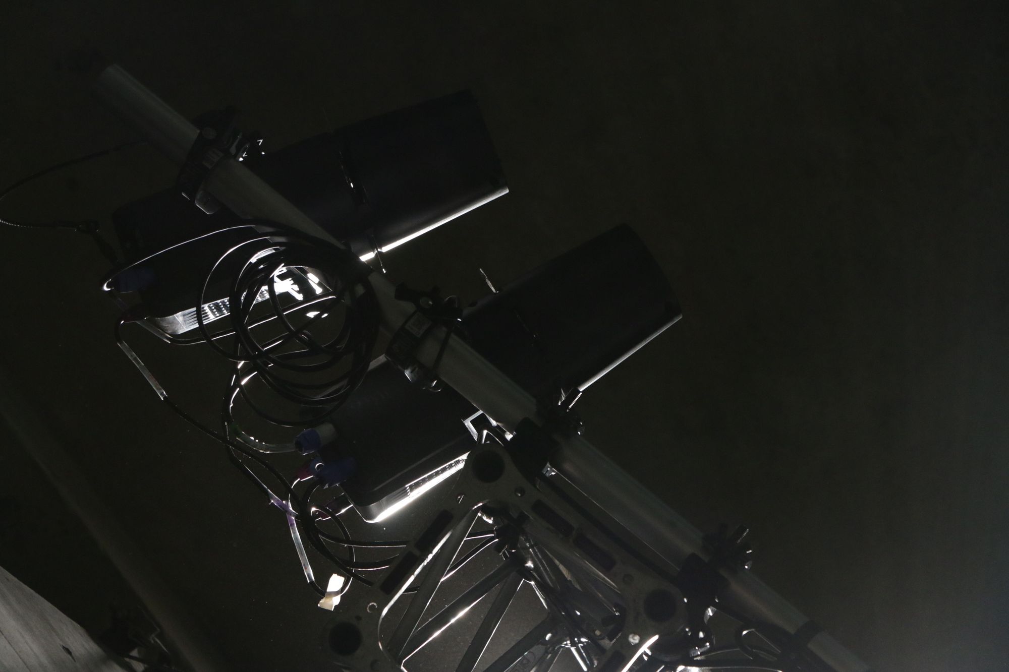 Profile fixtures rigged on a truss in a dark room