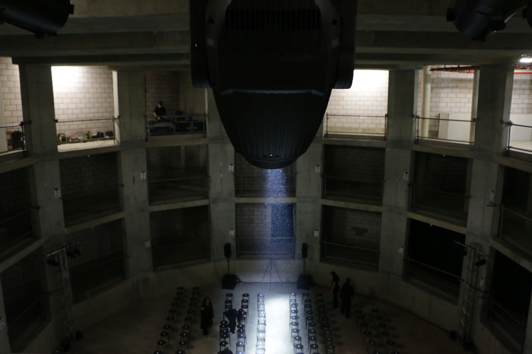 Moving head over a tiered concrete venue