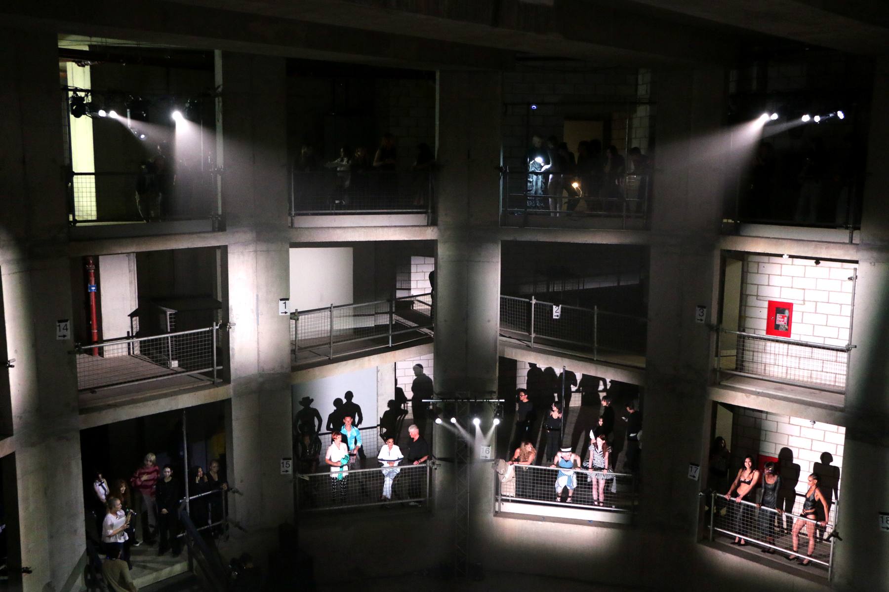 Fashion show staged across the balconies of an atrium